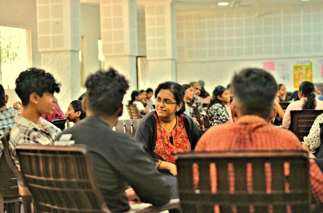 Group of people participating in a mental health workshop hosted by Aparna